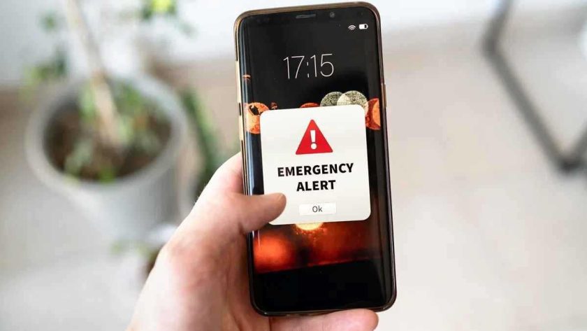 Smartphone showing emergency alert notification for LMC Alert system in Lalitpur