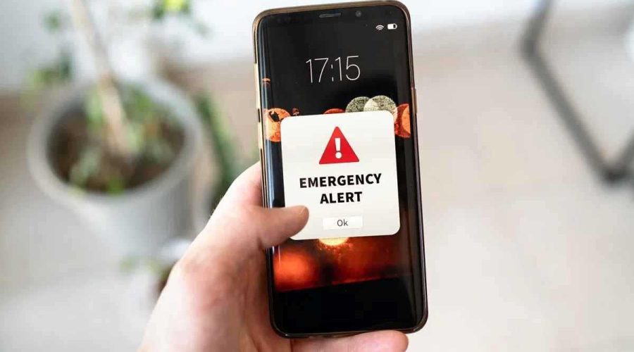 Smartphone showing emergency alert notification for LMC Alert system in Lalitpur